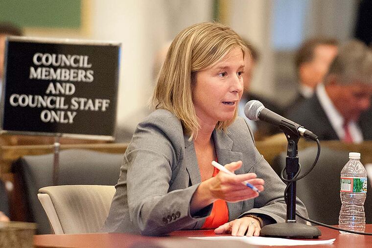 File: Former Licenses and Inspection commissioner Fran Burns answers a question during a special city council investigative committee hearing on demolition practices in Philadelphia and elsewhere August 1, 2013.