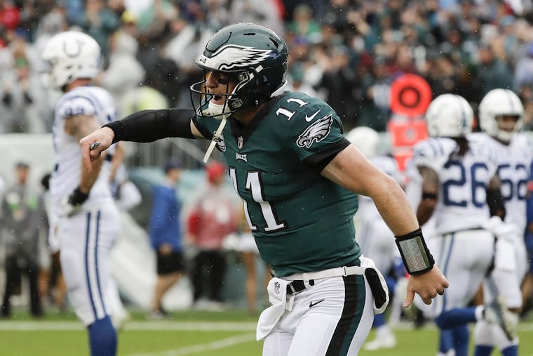 Eagles quarterback Carson Wentz celebrates his first-quarter touchdown pass to Dallas Goedert.