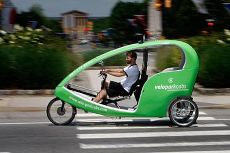 Sean Leahy, a driver for Veloparkcabs, pedals around Logan Circle on his first day on the job. (Michael S. Wirtz / Staff Photographer)