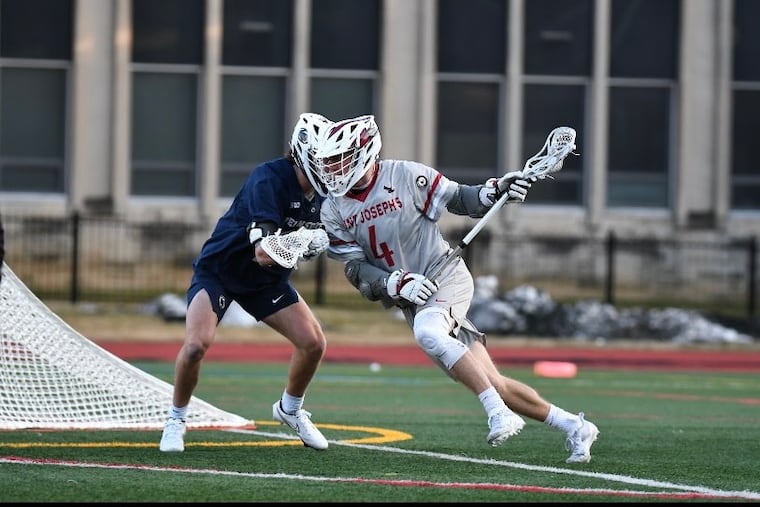 Matt Bohmer of St. Joseph's University men's lacrosse team charges in to the attack against Penn State.