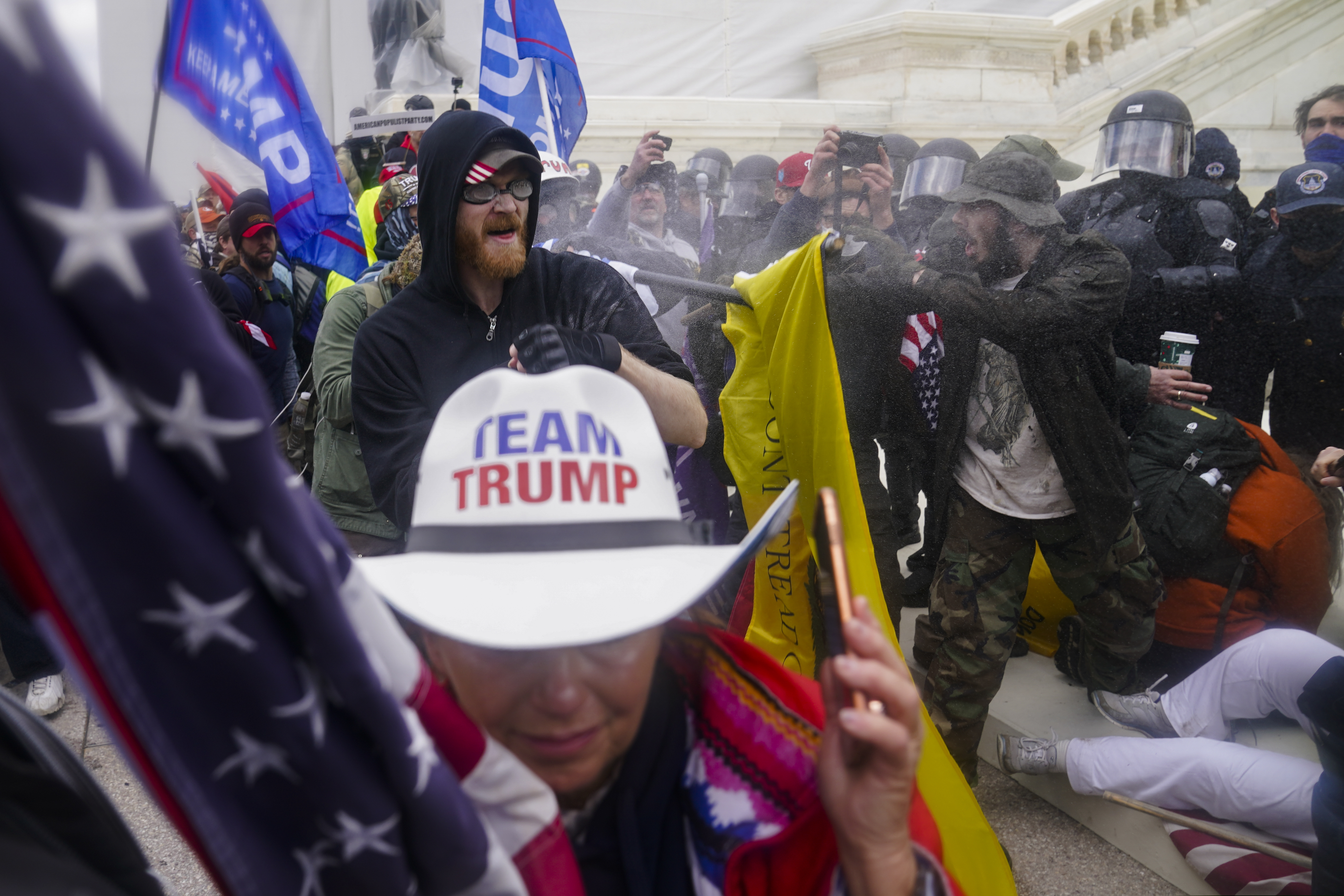 In this Jan. 6 photo, insurrections loyal to President Donald Trump try to break through a police barrier at the Capitol in Washington.