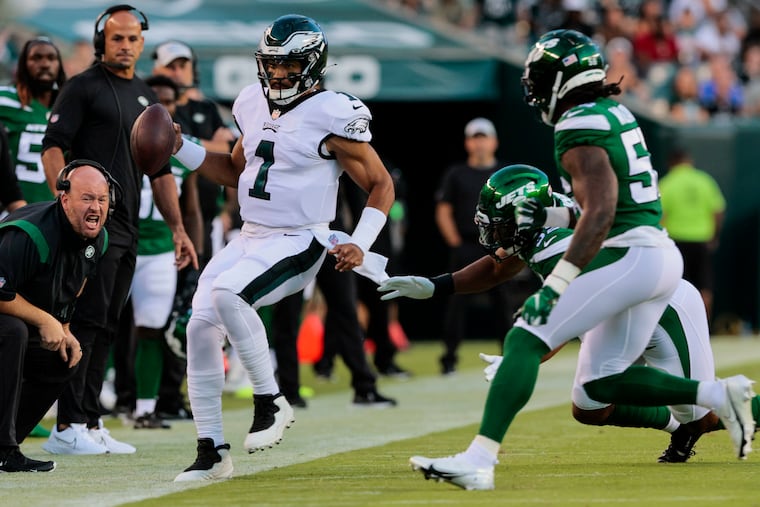 Jalen Hurts (1) steps out of bounds during the first quarter of the Eagles' 24-21 preseason loss to the New York Jets on Friday night.