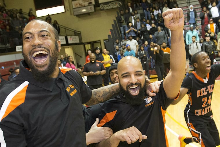 Rushing onto the court with his team, Del-Val Charter coach Jason Harrigan (center) celebrates the Public League crown.