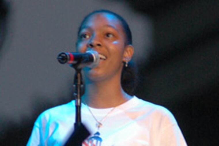 Keisha Elmore sings at July 4 festivities.