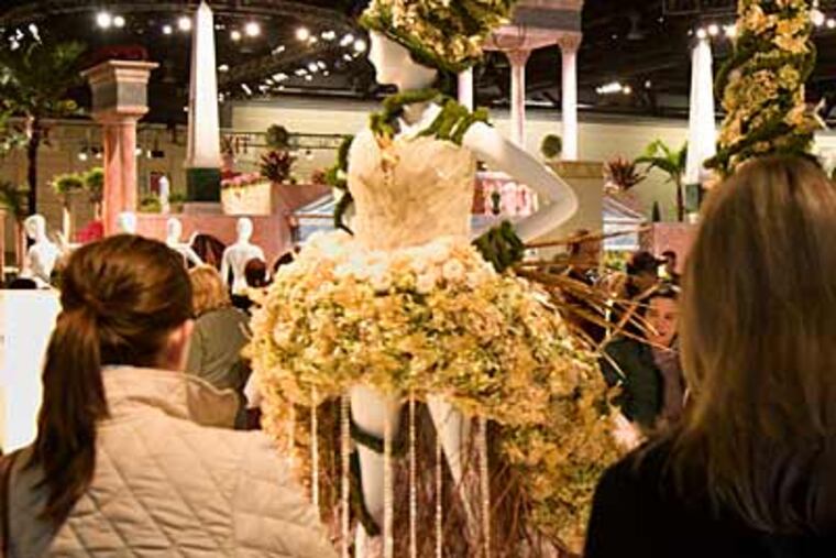 A fantastical floral sculpture attracts attention at the Philadelphia Flower Show. The show is open today, and not crowded, apparently because of the snowy weather. (Ed Hille / Staff Photographer)