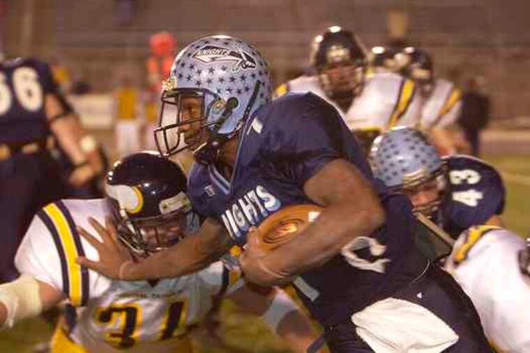 Kevin Akins picks up yardage for North Penn in the 2003 state title game against Pittsburgh Central Catholic. Akins rushed for 2,065 yards and 24 TDs on 191 carries that year.