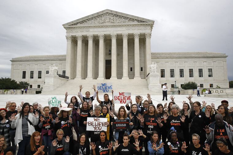 Protesters gather in front of the Supreme Court on Capitol Hill in Washington, Thursday, Sept. 27, 2018. The Senate Judiciary Committee is scheduled to hear Thursday from Supreme Court nominee Brett Kavanaugh and Christine Blasey Ford, the woman who says he sexually assaulted her.