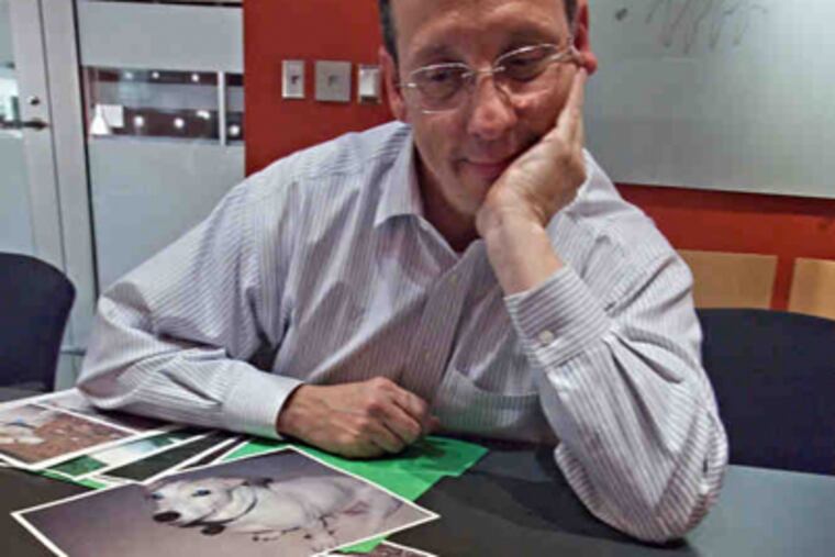 Frank Lucas, a Wynnewood architect, recalls his dog, Bailey, who was almost 17 when he died of a brain tumor. Lucas brought photos to Penn's Pet Loss Support Group. (David M Warren / Staff Photographer)