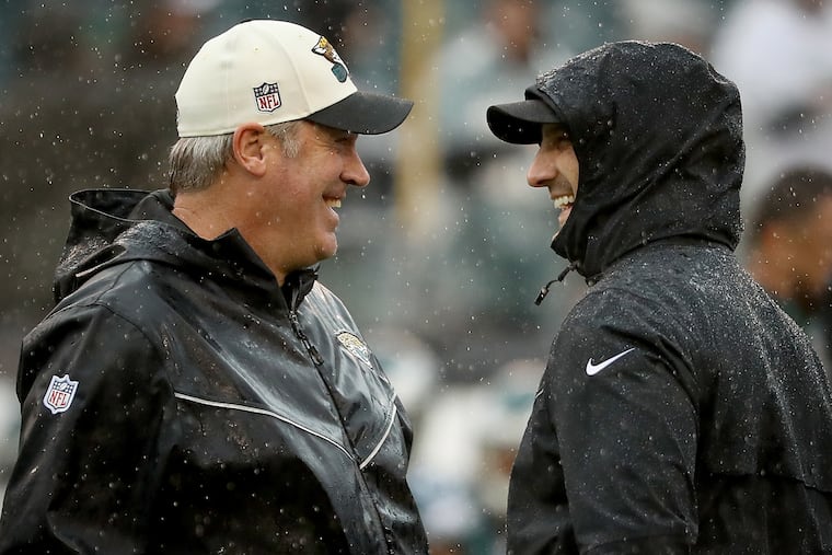 Jaguars coach Doug Pederson (left) and Eagles coach Nick Sirianni share a laugh before Sunday's game.