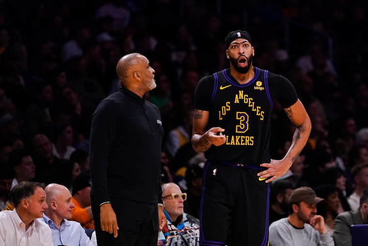 Phil Handy, left, has won titles with the Cavaliers, Raptors and Lakers as an assistant coach.