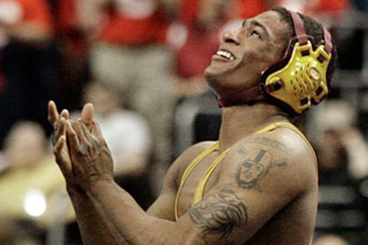 Anthony Robles reacts after winning his match at the Wells Fargo Center on Saturday. (Elizabeth Robertson/Staff Photographer)