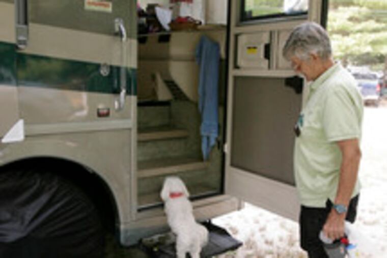 Karen Popp waits for Roxie to climb aboard. Popp shares a 40-foot Winnebago with her partner, Dixie Crownover, and two dogs. "RVing makes it possible for us to see the country and make friends," says Crownover, a teacher who took to the road in 1993.