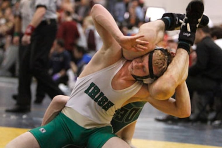 In 132 match Camden Catholic,foreground, Nick Minkiewicz decision over Sean Brophy for Depaul. ( Ron Cortes / Staff Photographer ) editor's note: JMAT13-, Camden Catholic vs DePaul Catholic in Non-Public B Sectional Championship on Sunday, February 12, 2012 at Tom's River North High School.c