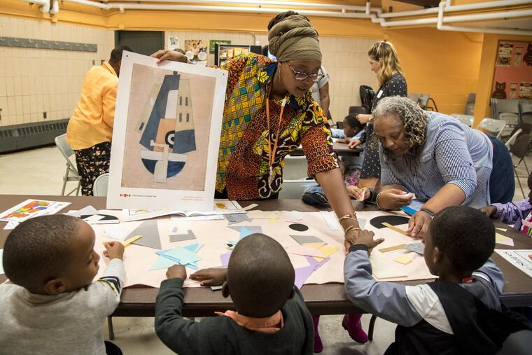 Jihan Thomas, Barnes Foundation K-3 grade outreach coordinator, uses a replica of Marsden Hartley’s “Movement, Bermuda” as a teaching tool for pre-K kids in the Community Concerns No. 13 program at Mander Recreation Center.