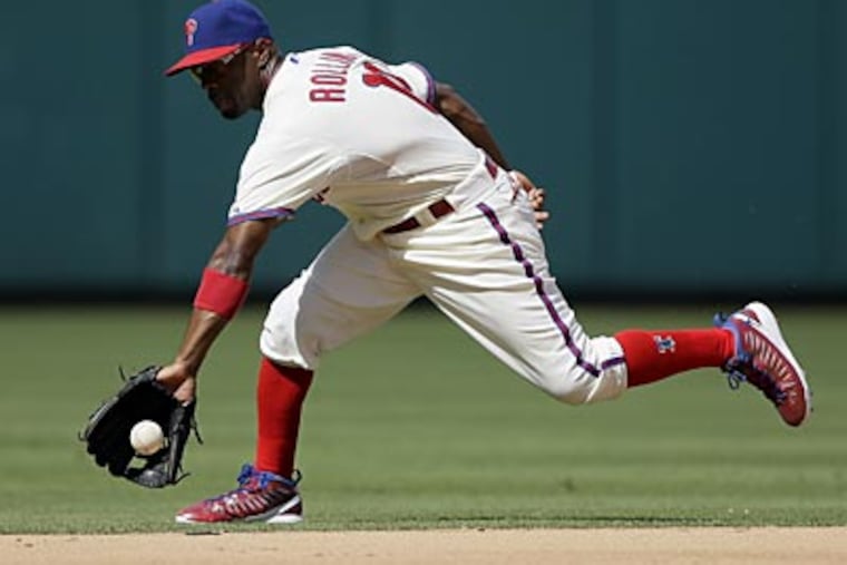 Jimmy Rollins' four Gold Gloves rank third in Phillies history behind Mike Schmidt (10) and Garry Maddox (8). (Matt Slocum/AP)