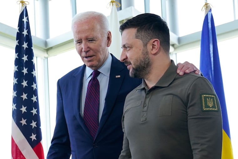 President Joe Biden (left) walks with Ukrainian President Volodymyr Zelenskyy ahead of a working session on Ukraine during the G7 Summit in Hiroshima, Japan, in May. Biden’s reluctance to expedite the delivery of needed weapons systems to Ukraine is inexplicable, writes Trudy Rubin.