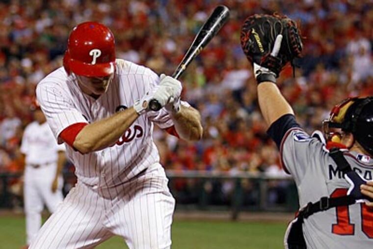 Chase Utley suffered a mild concussion after taking a pitch to the helmet on Wednesday. (Yong Kim/Staff Photographer)
