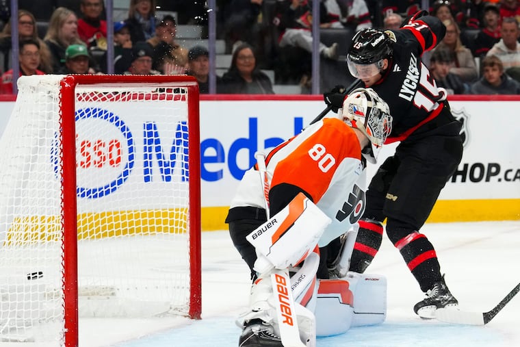 Ottawa Senators right winger Olle Lycksell (right), a former Flyer, scores past Flyers goaltender Dan Vladař during the second period.