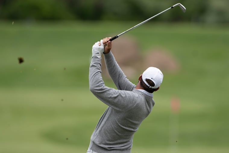 Scottie Scheffler practices on the fairway ahead of the PGA Championship at Aronimink Golf Club on Monday.