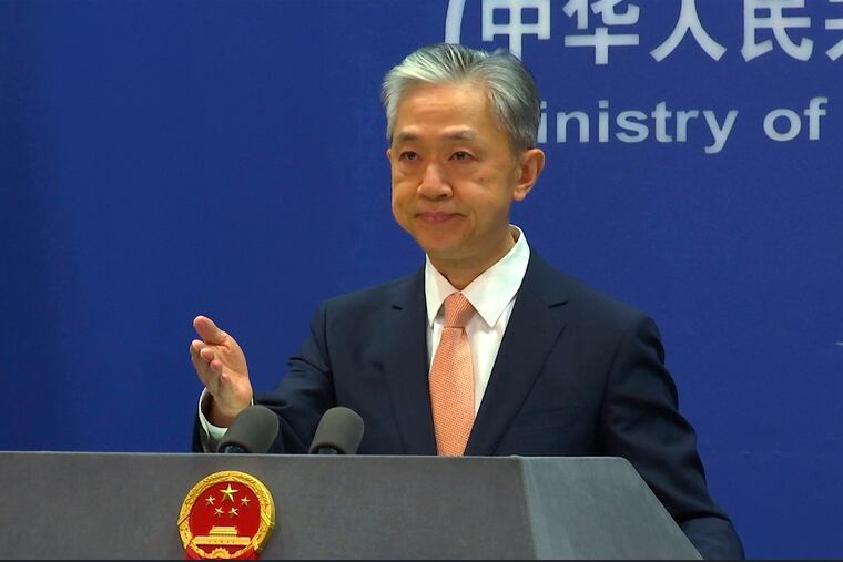 Chinese Foreign Ministry spokesperson Wang Wenbin reacts during the daily presser at the Ministry of Foreign Affiairs in Beijing in 2022.