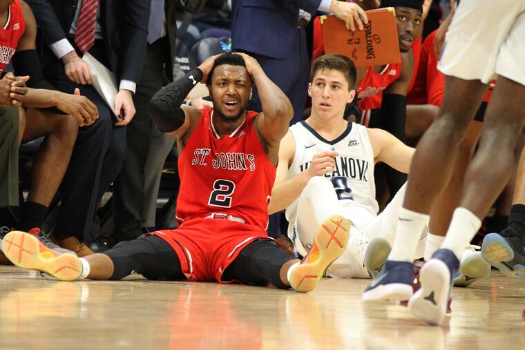 Collin Gillespie (right) wtaches as St. John's Shamorie Ponds gets called for a foul late in Tuesday's game.