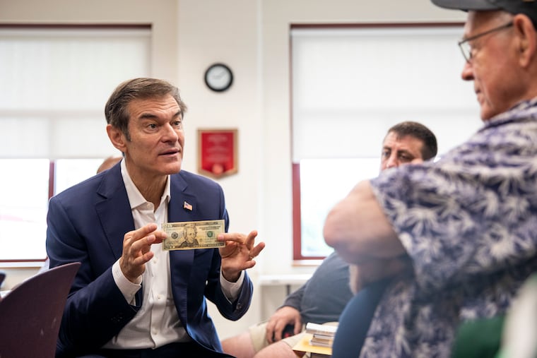 Republican Mehmet Oz speaks to supporters at a firehouse in Upper Darby Saturday as he campaigns for the nomination for U.S. Senate.