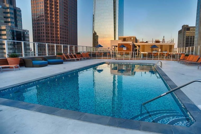 Rooftop pools and other amenities can drive up apartment costs.