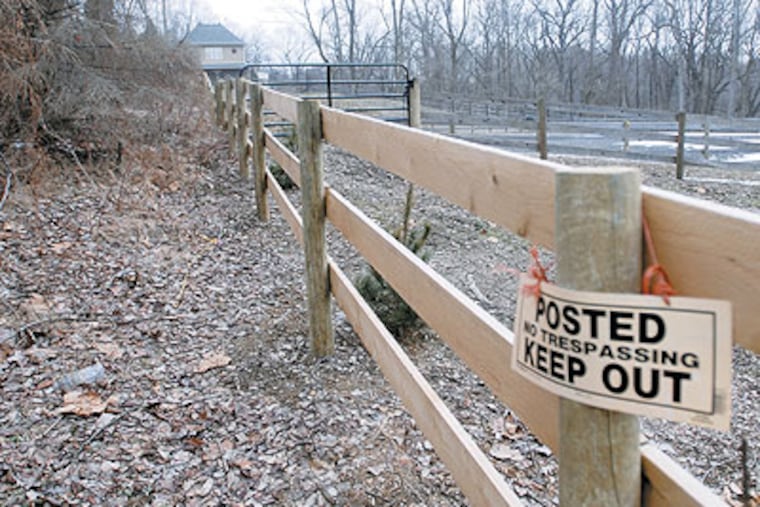 A "keep out" sign hangs on a horse pen near Nancy Veloric's home in Whitemash and she is not happy about it. (Ron Tarver / Staff Photographer)