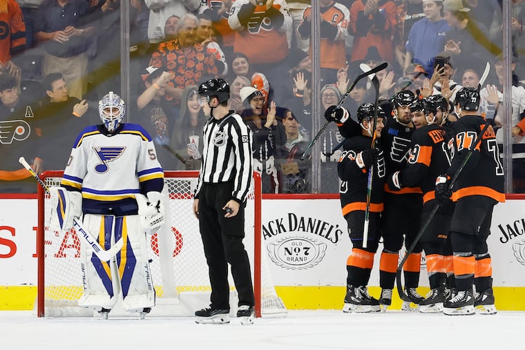 The Flyers celebrate right wing Garnet Hathaway’s first period goal against the Blues.