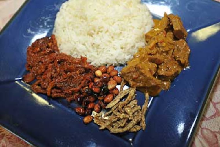 Nasi Lemak With Beef Rendang is a spicy concoction and the most popular breakfast in Rachel Gouk’s home country. She has learned to prepare it in a kitchenette at Rider University. (SHARON GEKOSKI-KIMMEL / Staff Photographer)
