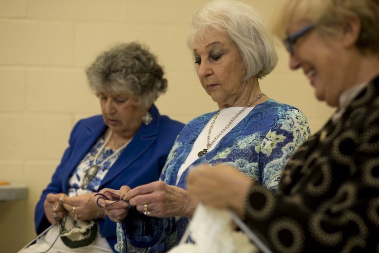 Mickie Levin (left), Joyce Adelman and Ella Kruglikov knit for Mim & Ray at KleinLife, a senior center in Northeast Philadelphia.