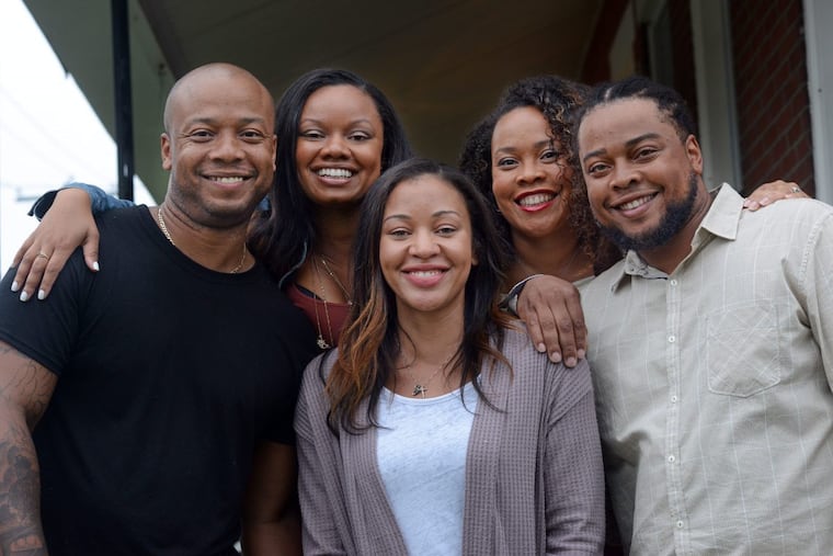 From left, Kevin Overton of Philadelphia, Cherjon Overton of Deptford, N.J., Sally Armstrong of Dallas, Texas, Sterling Overton-Crawford of Fredericksburg, Va., and Dorein Overton of Westville, N.J., pose for a photograph after meeting for the first time.