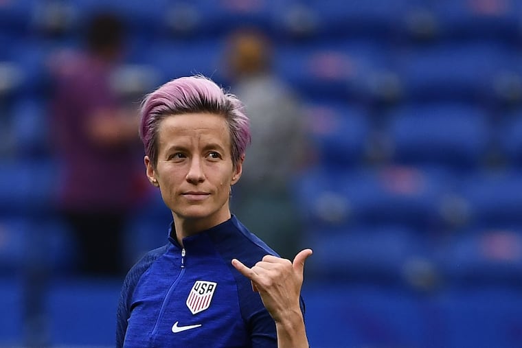 TOPSHOT - United States' forward Megan Rapinoe gestures as she walks around the pitch prior to the France 2019 Women's World Cup semi-final football match between England and USA, on July 2, 2019, at the Lyon Satdium in Decines-Charpieu, central-eastern France. (Frankck Fife/AFP/Getty Images)