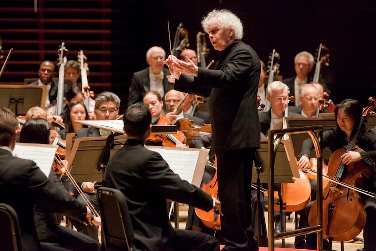 Simon Rattle conducting the Philadelphia Orchestra on Thursday. Pianist Lang Lang was guest soloist. As a curtain-raiser, Rattle used "Unstuck," by composer Andrew Norman. JESSICA GRIFFIN / Staff Photographer