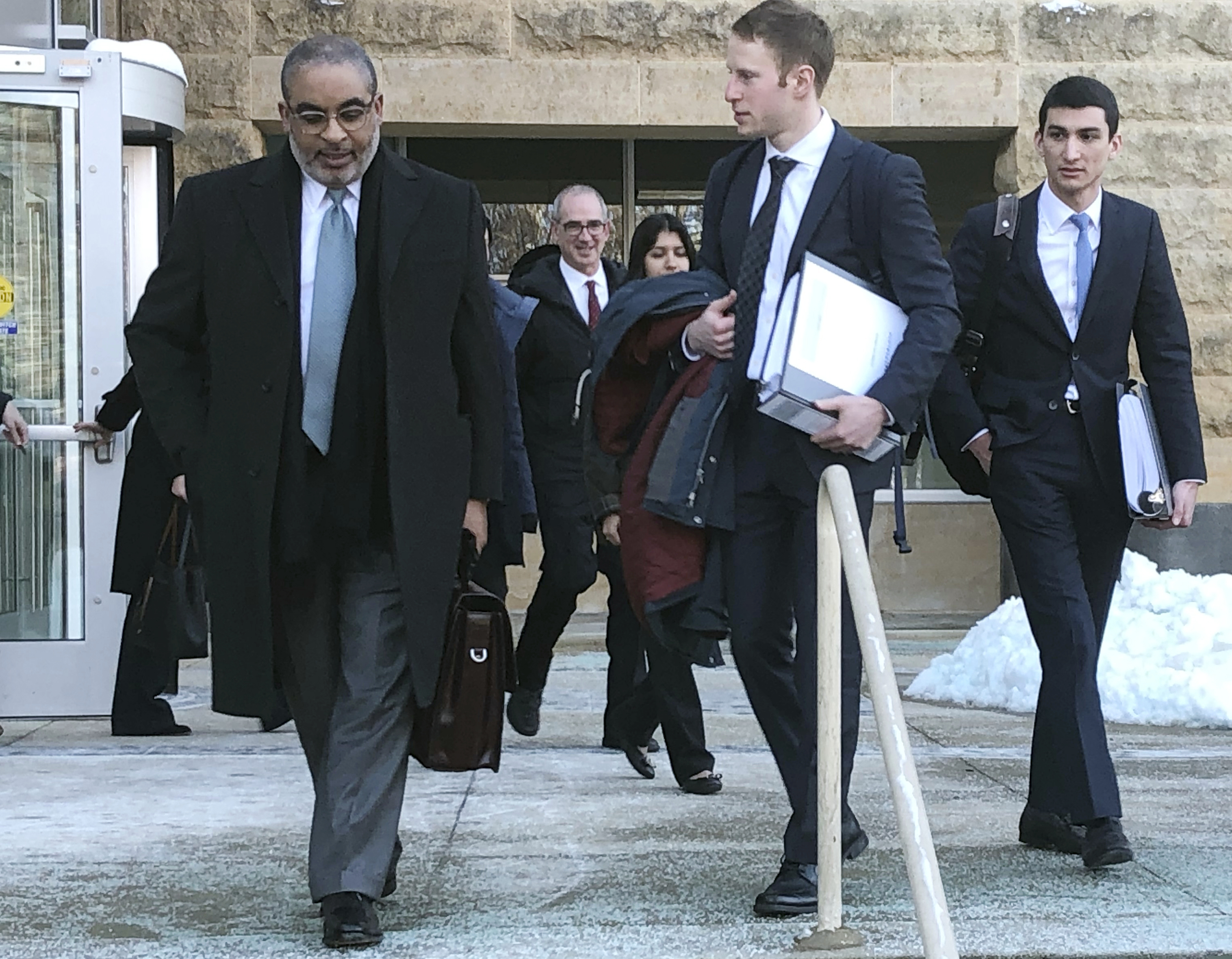Attorneys leave the federal courthouse in Greenbelt, Md., after a hearing on the federal government's motion to dismiss the NAACP lawsuit over concerns about the 2020 census. From left are NAACP general counsel Bradford Berry, Joseph Schottenfeld, third-year student at Yale Law School, and Jeffrey Zalesin, third-year student at Yale Law School. (AP Photo/Michael Kunzelman)