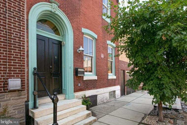 This three-story East Kensington house was once carved into five apartments. Now it's a three-bedroom, 3 1/2 bath single-family home.