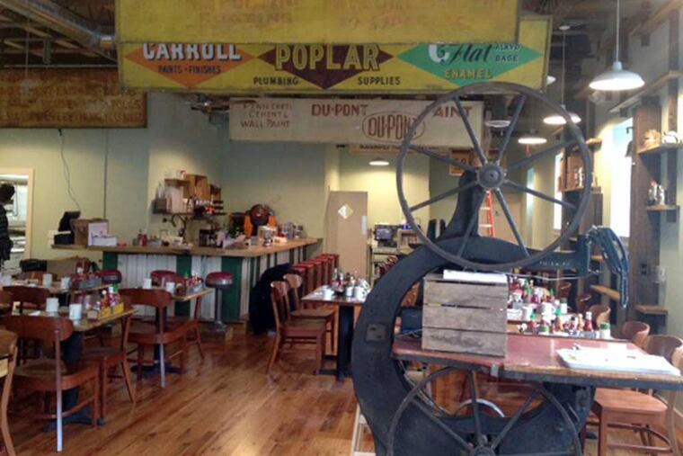 Under old paint signs, the dining room at Honey's Sit N Eat, 21st and South Streets, at its opening in 2013.