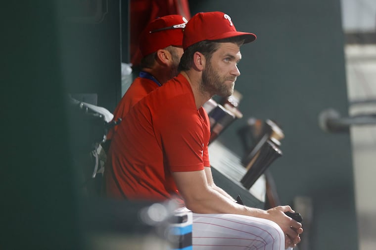 Bryce Harper is focused on regaining his swing more than his throwing arm as he works his way back from injury.