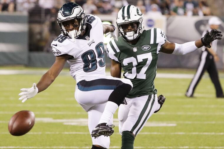 Philadelphia Eagles wide receiver Greg Ward reaches to catch football against New York Jets cornerback Bryson Keeton in the third quarter on Thursday, Aug. 31, 2017, at MetLife Stadium in East Rutherford, N.J.