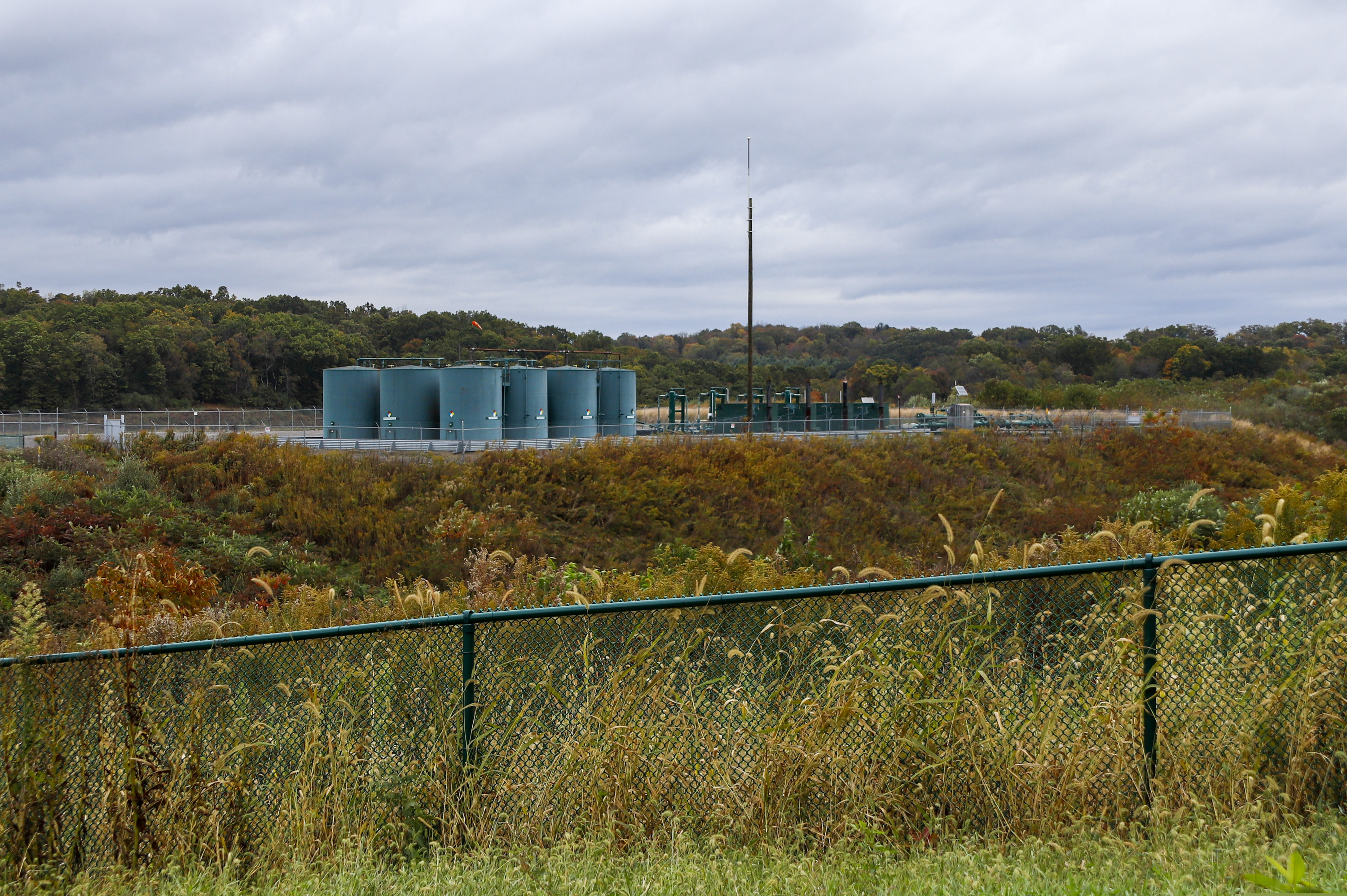 Storage tanks at a shale gas well pad in Zelienople, Pa. in Oct. 2019. Fracking is as the center of the climate change debate in Pennsylvania, where as in much of the world environmental advocates warm of a grim future, while others question those projections.