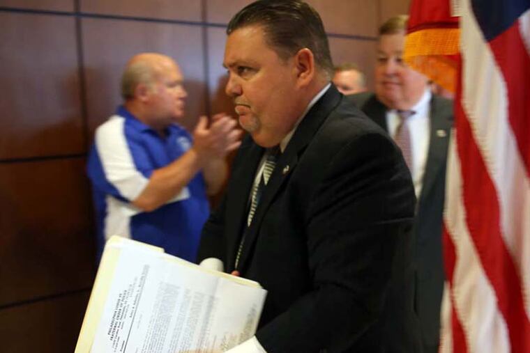 John J. McNesby, president of Philadelphia Lodge 5 Fraternal Order of Police, leaves the room after news conference at the lodge in Northeast Philadelphia on July 16, 2014. McNesby questioned the reporting in the Philadelphia Daily News series "Tainted Justice." DAVID MAIALETTI / Staff Photographer