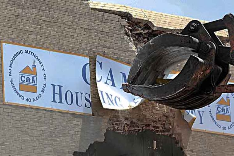 Starting at the back of the building, crews begin demolition of the Sears building on the Admiral Wilson Boulevard in Camden June 5, 2013, 42 years after the 1927 neoclassical retail landmark closed its door to shoppers. It will become a Campbell Soup Company project. ( TOM GRALISH / Staff Photographer )