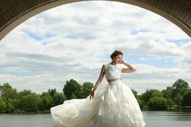 Mikado crop top with organza ball-gown skirt, limited edition ($1,150) at David's Bridal, with pearl-drop earrings ($1,300) at Rosnov Jewelers. (Michael Bryant / Staff Photographer)