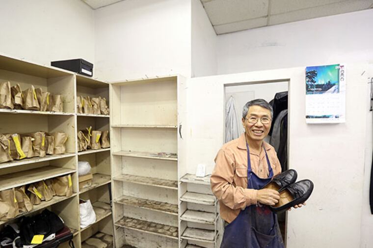Owner Wan Song of Superior Shoe Repair, 138 S. 15th Street which is closing today, Dec. 31, 2014, after 32 years. ( DAVID SWANSON / Staff Photographer )