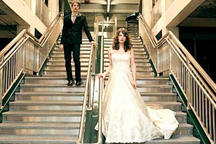 Leann Greto and Matthew Ashby love SEPTA and jumped at the chance to have their wedding photos taken at the Walnut-Locust Station on Jan. 17. They had a traditional ceremony later that day at a catering hall. The idea was suggested by their wedding photographer, Lorraine Daley, who took this shot and all the others. Scanned February 5, 2009 for a Jill Porter column. Mandatory photo credit: Lorraine Daley Photography