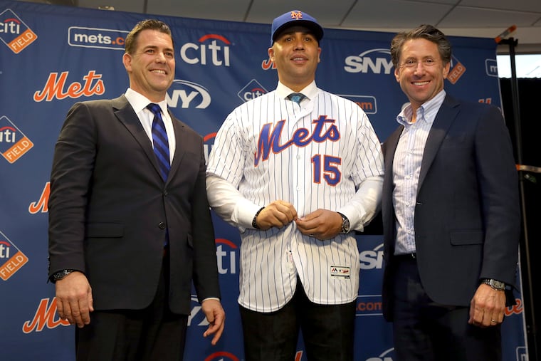On Nov. 4, newly named Mets manager Carlos Beltran, center, posed for a picture with general manager Brodie Van Wagenen, left, and Mets COO Jeff Wilpon during a news conference at Citi Field in New York.