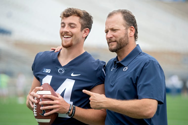 Penn State quarterback Sean Clifford with offensive coordinator Mike Yurcich in August.