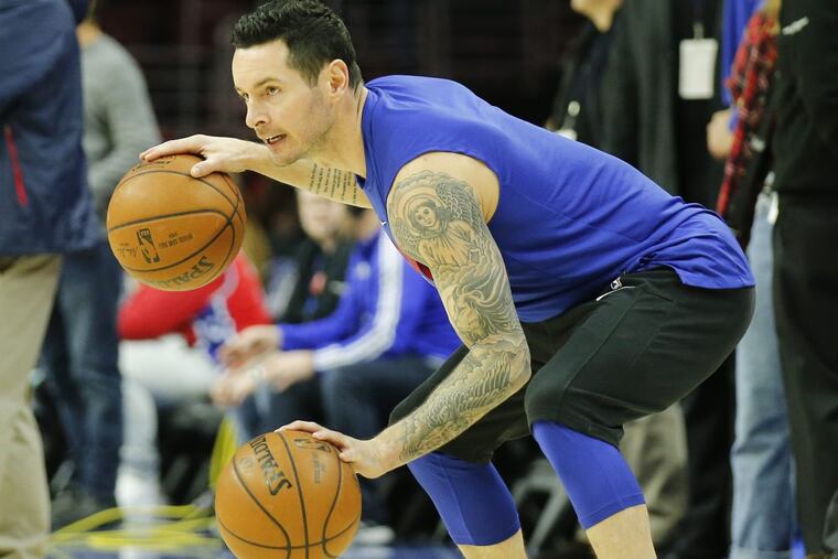 Sixers guard JJ Redick dribbles two basketballs during warm-ups prior to the game against the Detroit Piston on Friday, January 5, 2018 in Philadelphia.