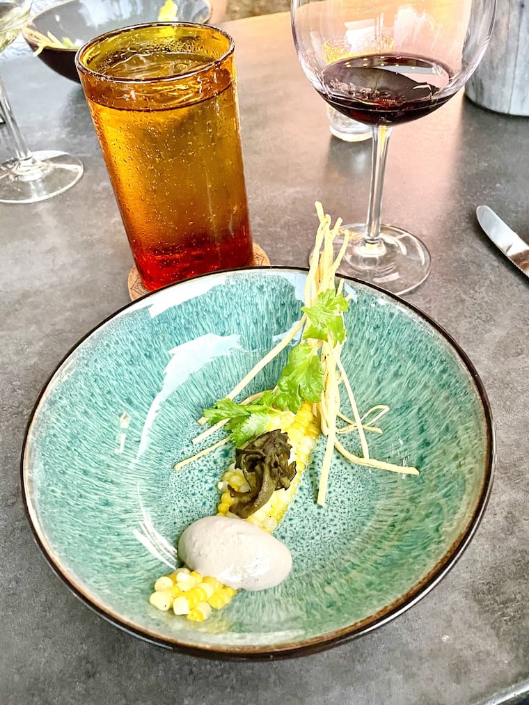 The corn soup with huitlacoche crema and tortilla chips at Revival Kitchen in Reedsville, Pa., is presented at the table with its garnishes visible before the sweet corn soup is poured over top tableside.