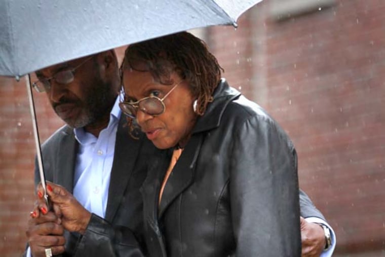 File photo: Walking from arraignment at Montgomery County District Court in Abington, state prosecutors bring corruption charges against longtime Philadelphia area legislator LeAnna Washington, Wednesday March 12, 2014. ( DAVID SWANSON / Staff Photographer )